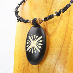 Carved Wood Oval on Black Beaded Collar