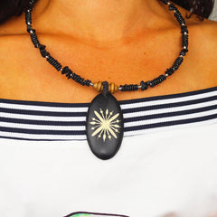 Carved Wood Oval on Black Beaded Collar