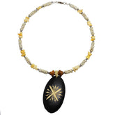 Carved Wood Oval on White Beaded Collar