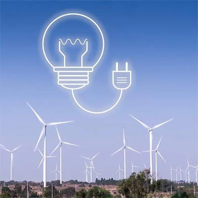 a wind farm with symbolic light bulb representing electricity production from renewables