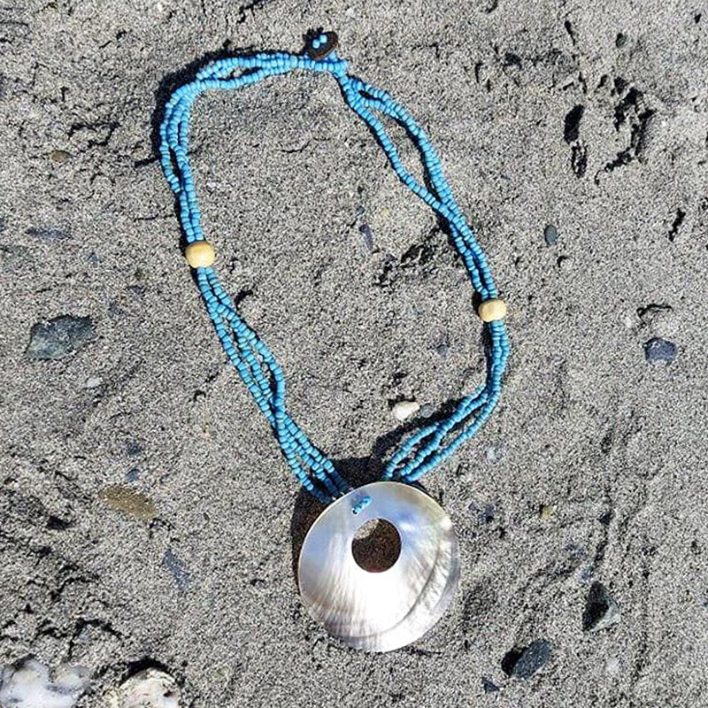 Torus Shell on Blue Beads